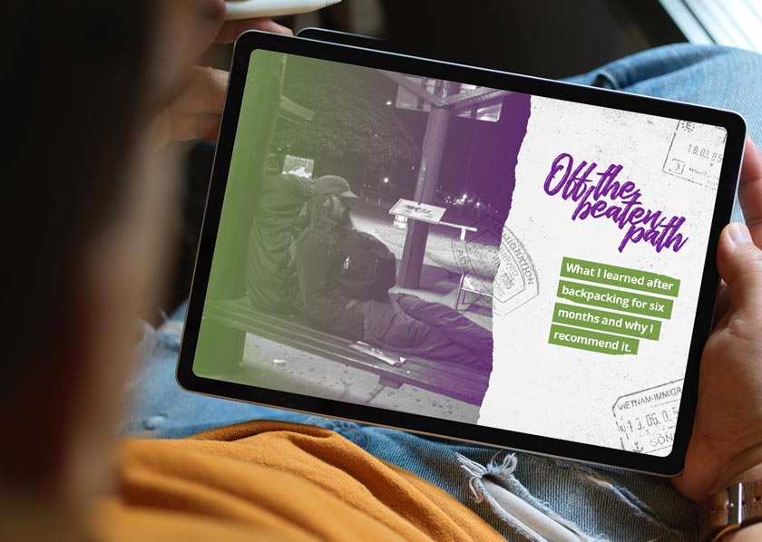 Person holding digital magazine on tablet